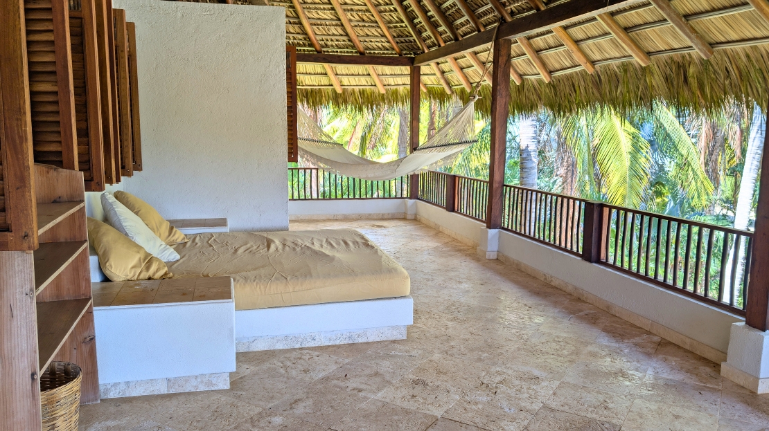 Open-air bedroom with hammock
